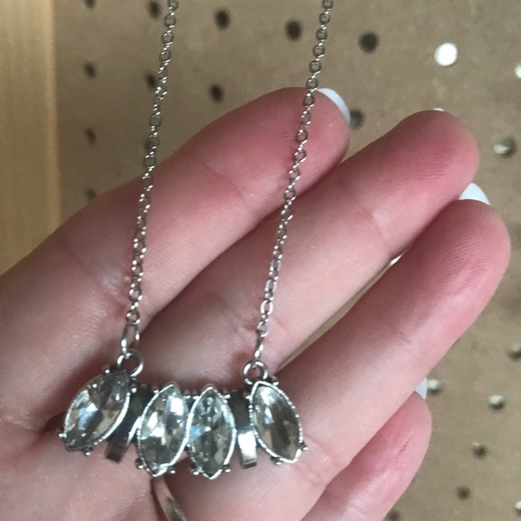 Silver necklace w/four diamond shaped crystals.